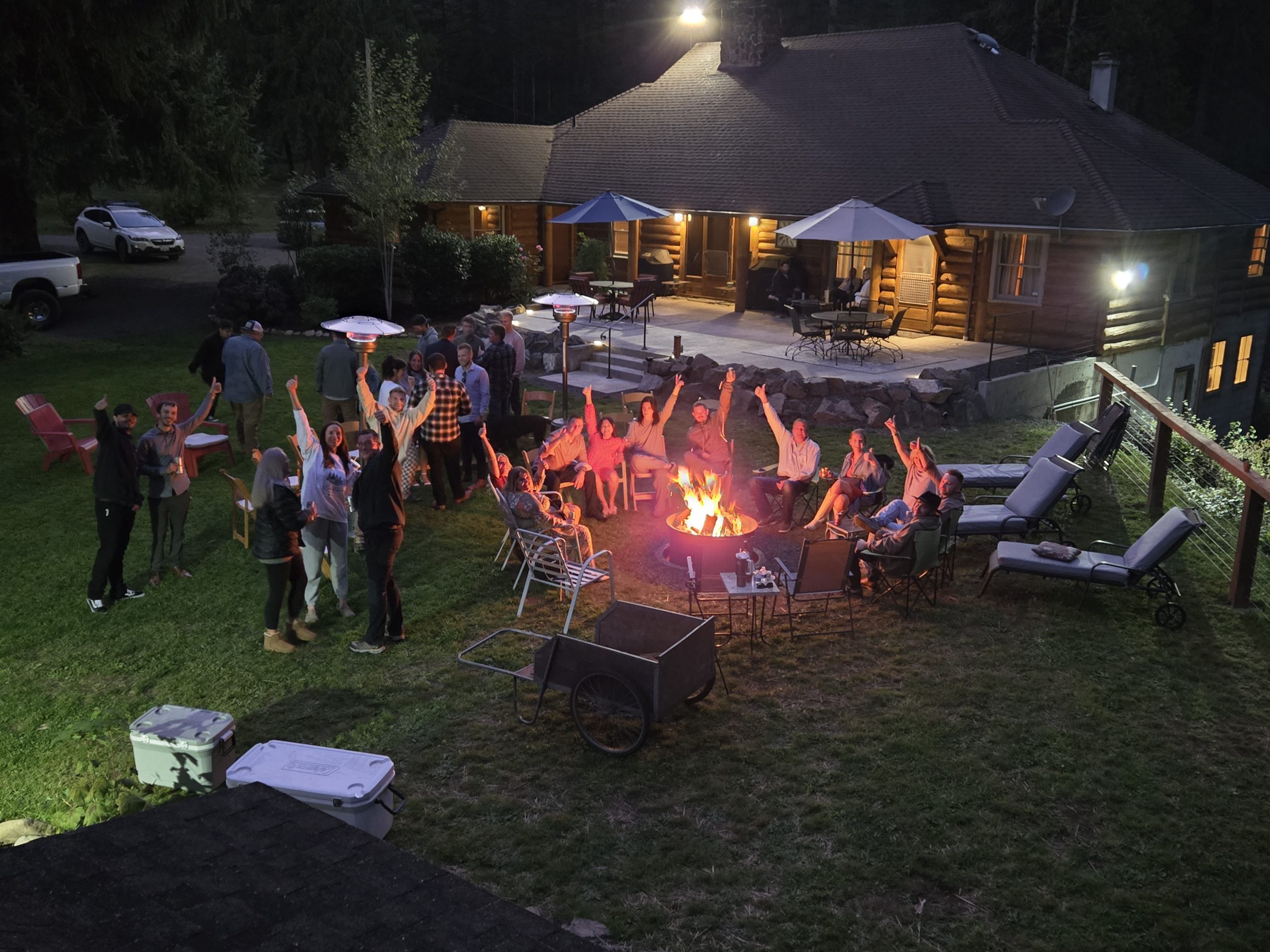 Group gathering around fire at Kanati Falls Ranch