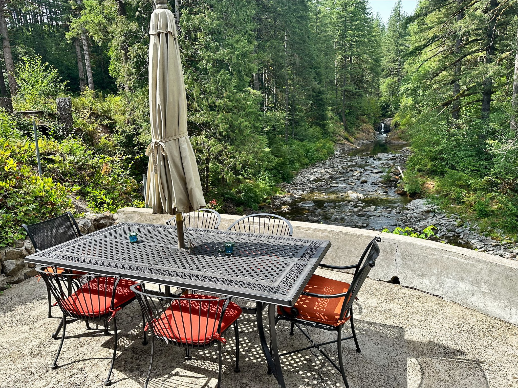 River patio and waterfall view